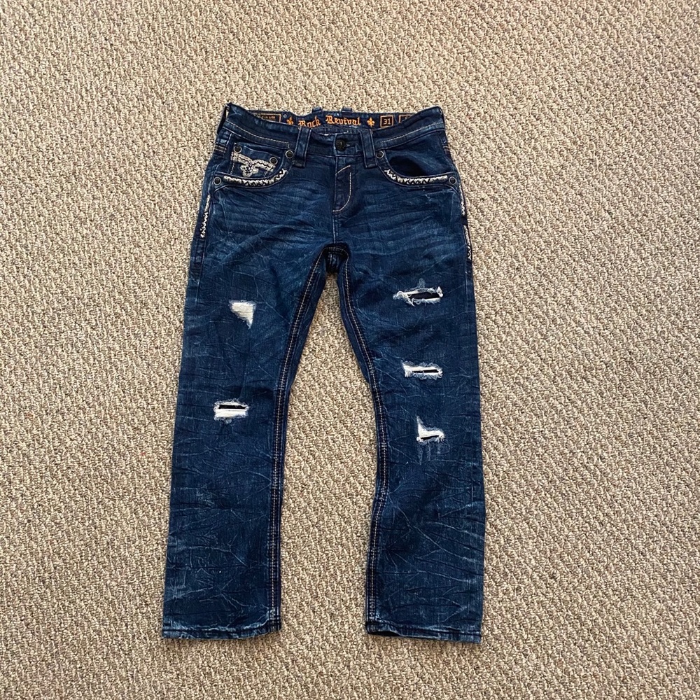 Dark blue ripped “Rock Revival” jeans